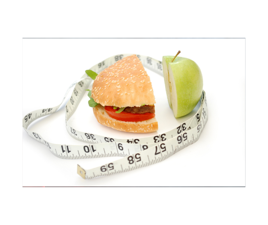 burger and apple with a tape measure around them