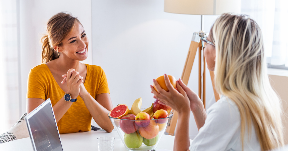 nutritionist meets with client to discuss weight management