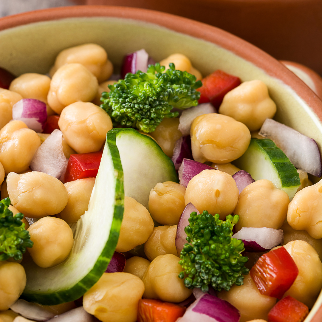 zoomed in view of a bowl of smashed chickpea salad